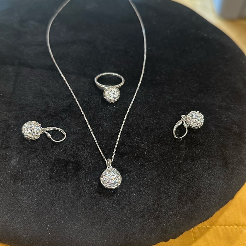 Matching set of pendant earrings and ring, embellished with 1.5 ctw Swarovski.